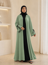 Pista green open-front abaya cardigan with black bow-tie cuffs